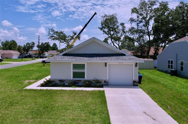 view of front of home with a garage and a front yard