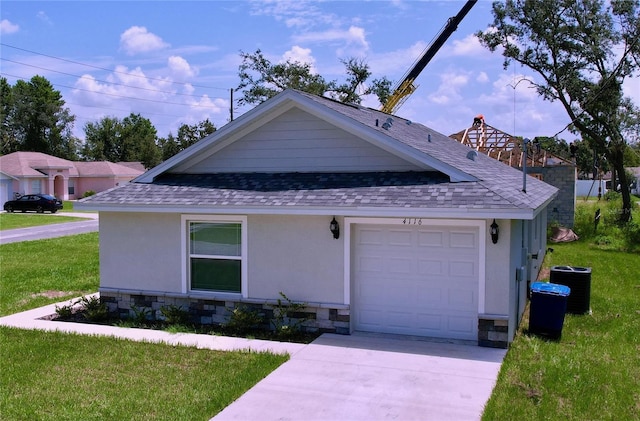 view of front facade with a garage and a front yard