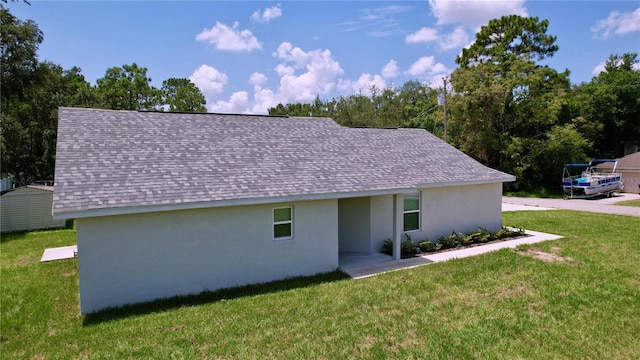 exterior space featuring a yard and an outdoor structure