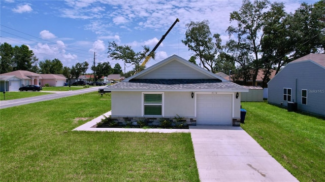 view of front of house with a garage and a front yard