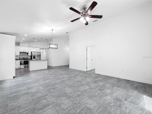 unfurnished living room featuring high vaulted ceiling, tile patterned flooring, and ceiling fan