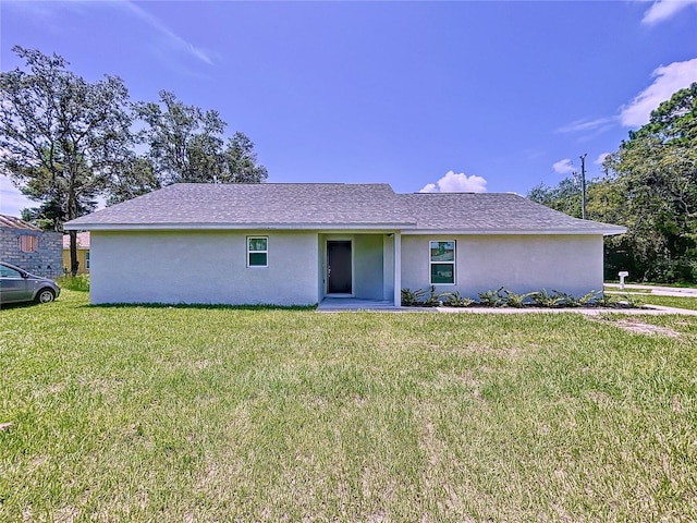 ranch-style home with a front yard