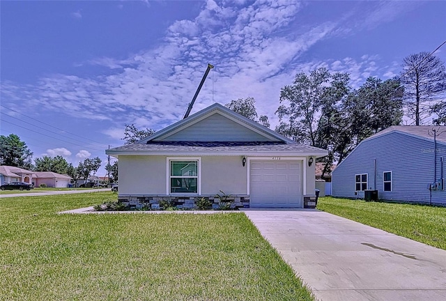 view of front of property with a garage and a front yard