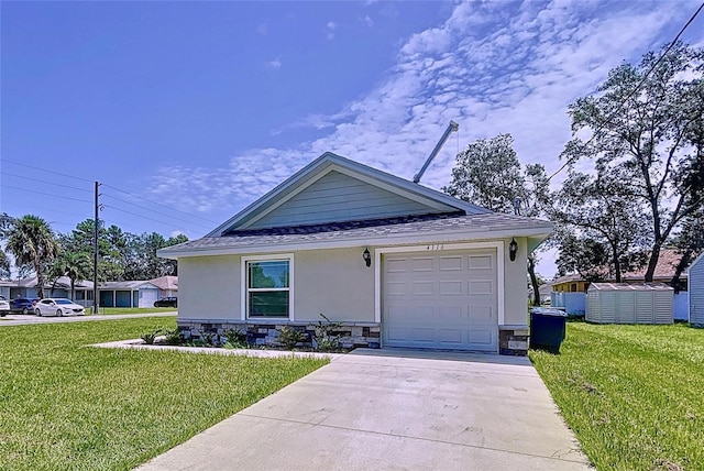 view of front of property featuring a garage and a front yard