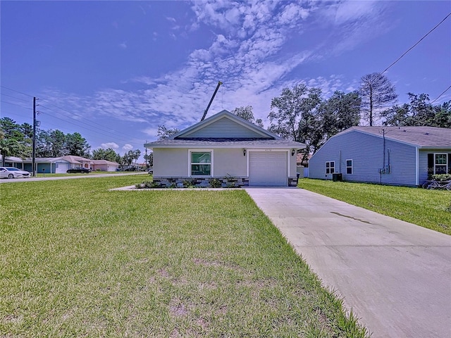 view of front of home with a garage and a front lawn