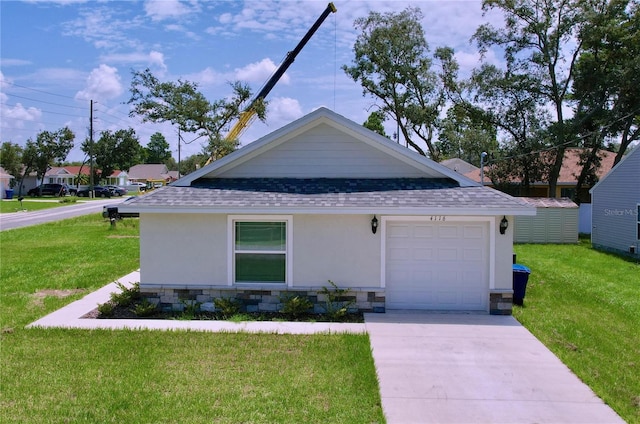 view of front of home featuring a garage and a front yard