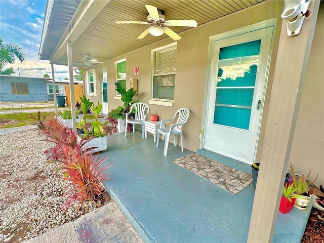 exterior space featuring ceiling fan and a porch