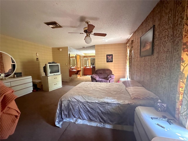 bedroom with a textured ceiling and ceiling fan