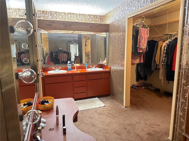 bathroom featuring vanity and a textured ceiling