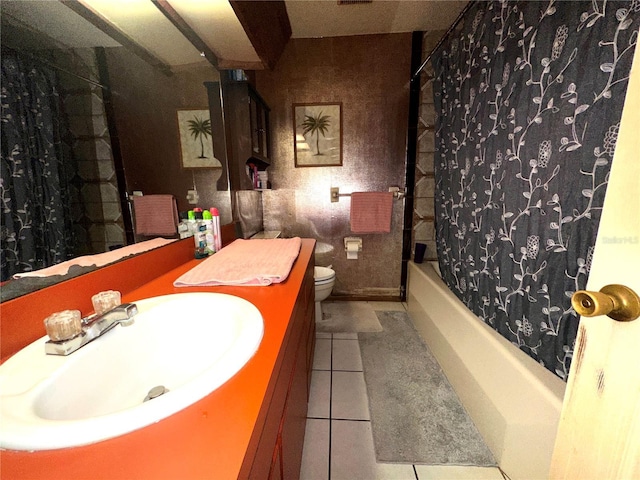 bathroom featuring sink, tile patterned floors, and toilet