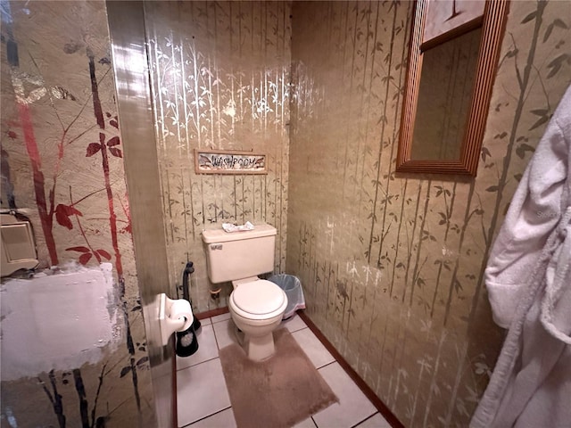 bathroom with tile patterned floors and toilet