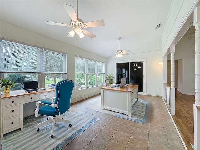 home office featuring light tile patterned floors, decorative columns, and ceiling fan