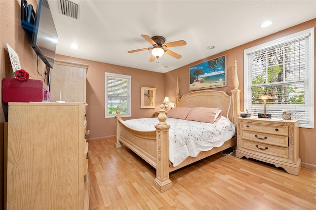 bedroom with ceiling fan and light wood-type flooring