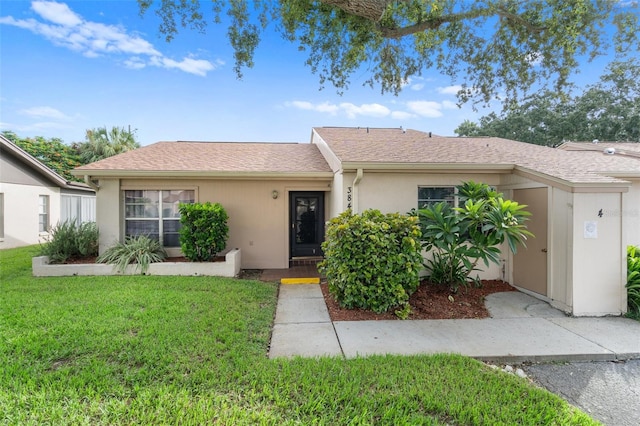 single story home with a front yard