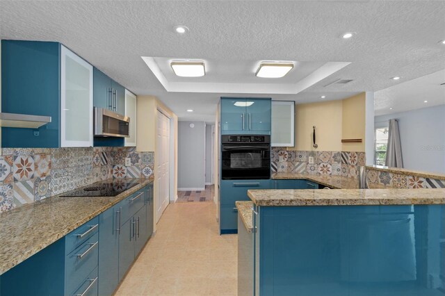 kitchen featuring black appliances, backsplash, light tile patterned floors, a textured ceiling, and blue cabinetry