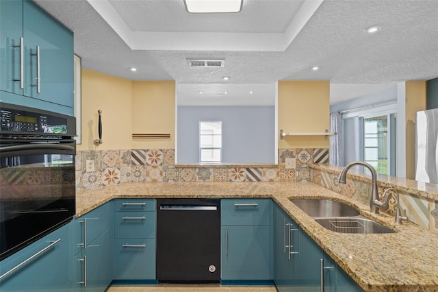 kitchen with decorative backsplash, black appliances, and plenty of natural light