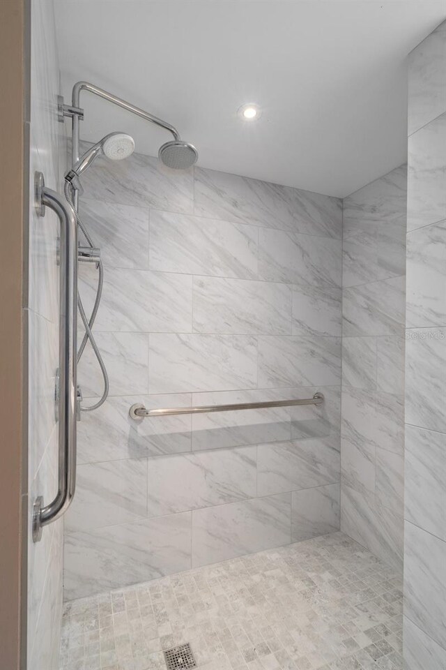 bathroom with a tile shower