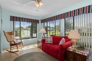 interior space featuring ceiling fan and plenty of natural light