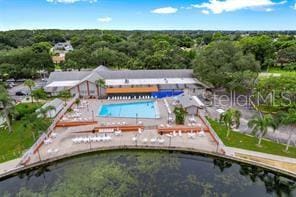 birds eye view of property with a water view