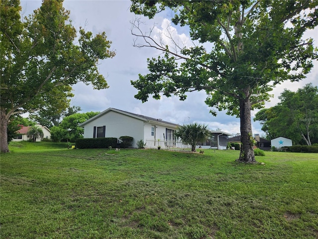 view of side of property featuring a yard