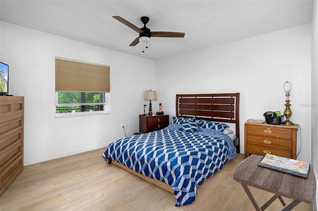 bedroom featuring ceiling fan and light hardwood / wood-style flooring