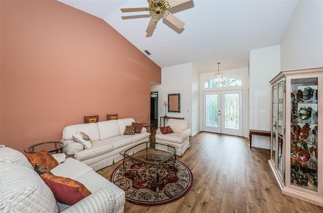 living room with high vaulted ceiling, french doors, wood-type flooring, and ceiling fan