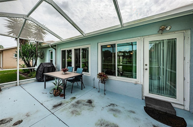 view of patio / terrace featuring a lanai and grilling area