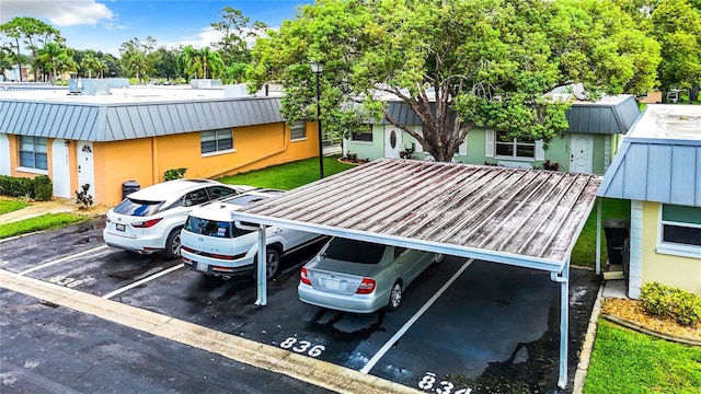 view of partially covered parking lot