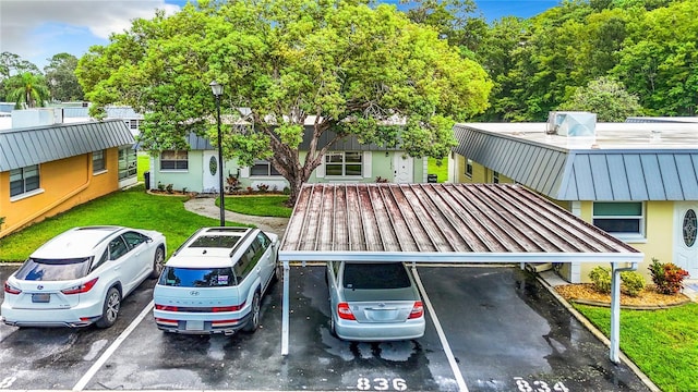 view of partially covered parking lot