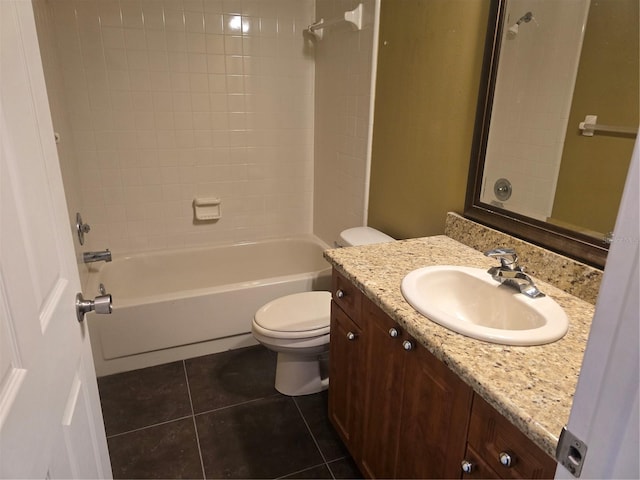 full bathroom featuring vanity, toilet, tiled shower / bath combo, and tile patterned flooring