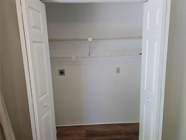 clothes washing area with dark wood finished floors, laundry area, and electric dryer hookup