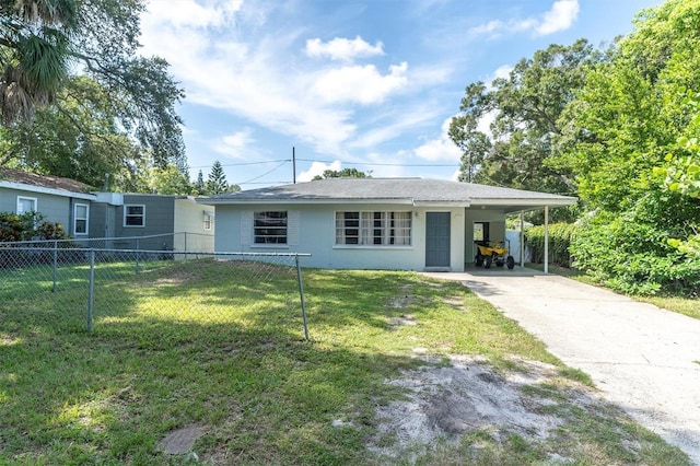 ranch-style house featuring a carport and a front yard