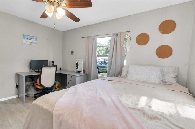 bedroom featuring light hardwood / wood-style flooring and ceiling fan