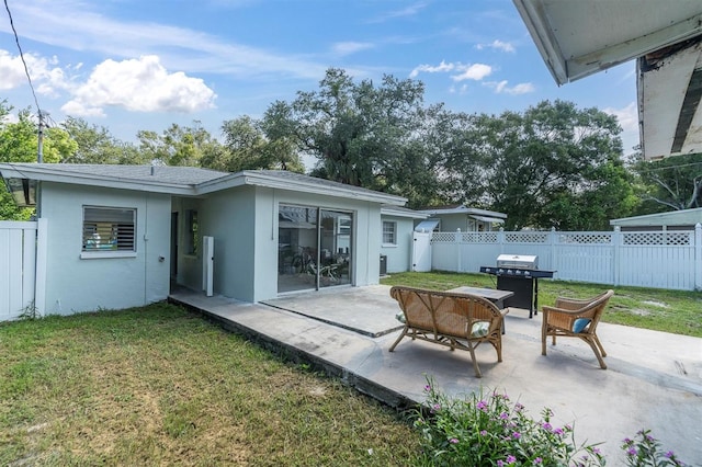 exterior space with a patio and a lawn