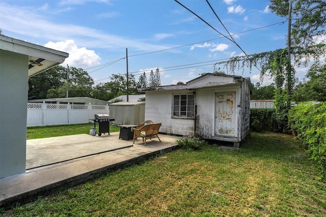 exterior space with a shed and a patio