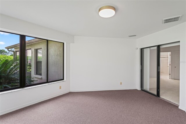 empty room featuring carpet flooring