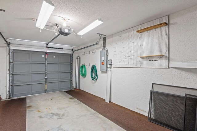 garage featuring a garage door opener and electric panel