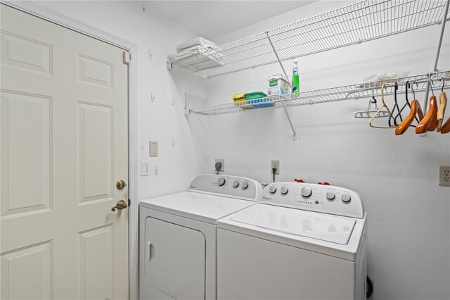 laundry room with independent washer and dryer