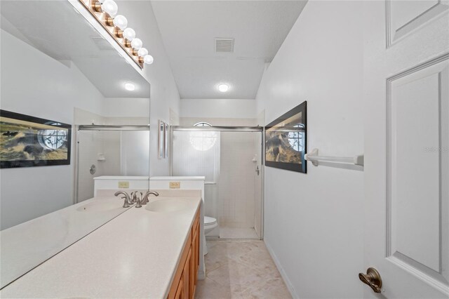 bathroom featuring toilet, tile patterned floors, and vanity