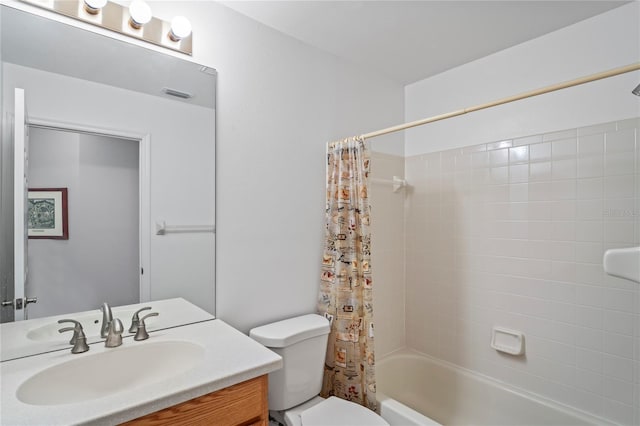 full bathroom featuring shower / bath combo with shower curtain, vanity, and toilet