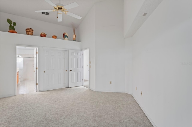 interior space featuring high vaulted ceiling and ceiling fan