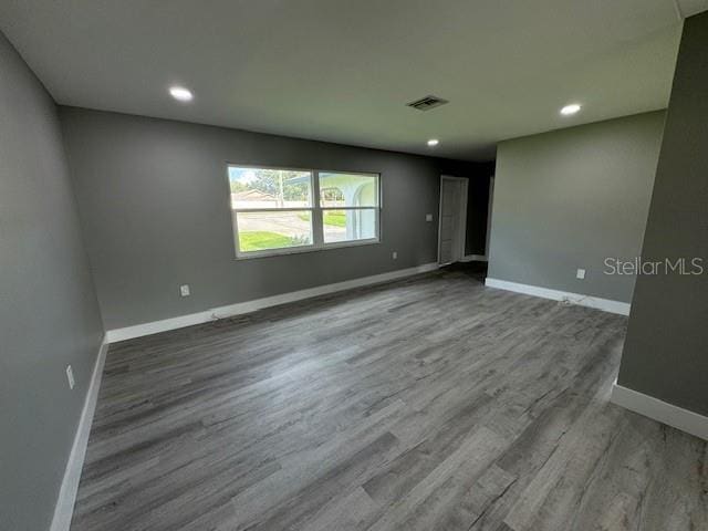 unfurnished room featuring wood-type flooring