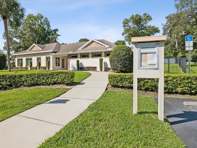 view of front of property with a front lawn