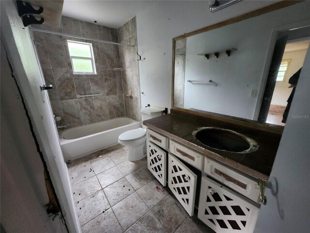 full bath with shower / bathtub combination, vanity, and toilet