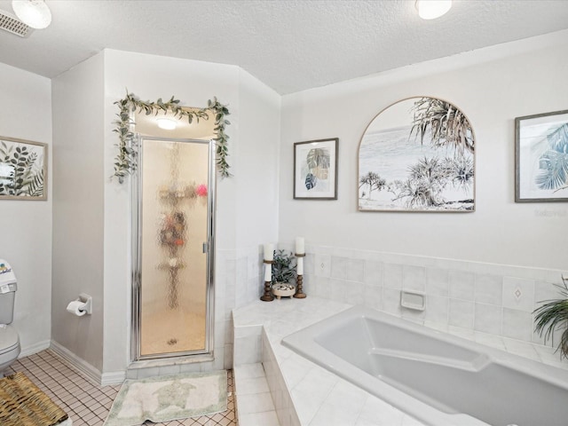 bathroom with tile patterned flooring, a textured ceiling, independent shower and bath, and toilet