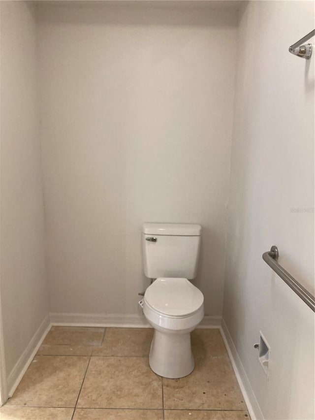 bathroom featuring toilet and tile patterned floors