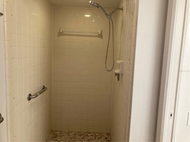 bathroom with tiled shower