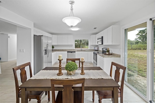 dining space with sink