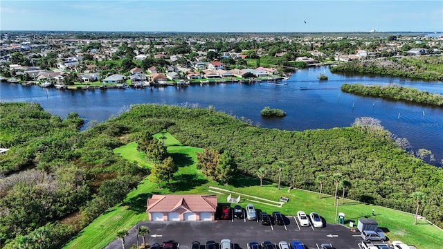 birds eye view of property with a residential view and a water view