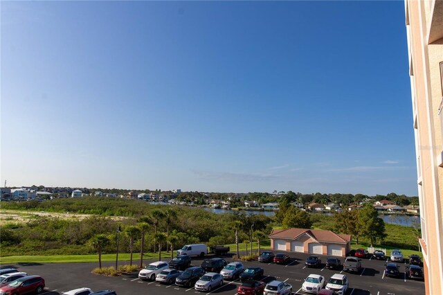 view of parking featuring a water view